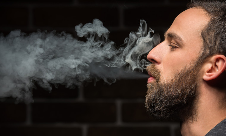 man smoking legal marijuana