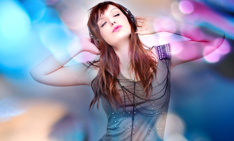 Relaxed woman enjoying music