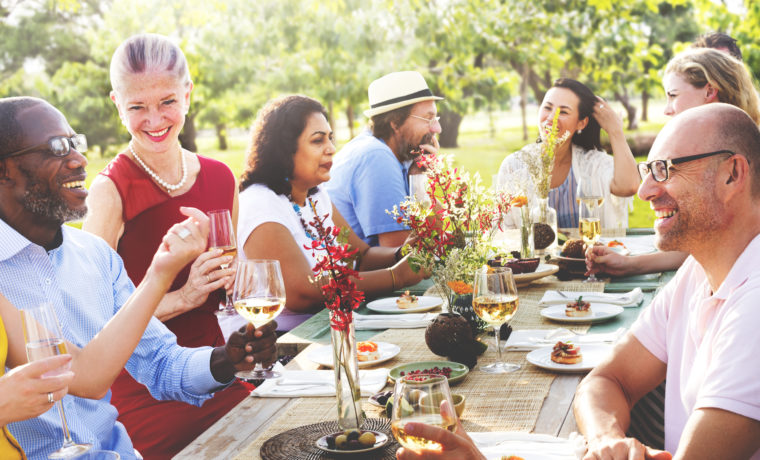 Image of happy people at a backyard cannabis-friendly garden party